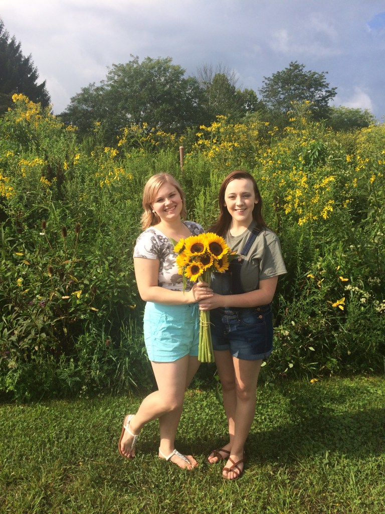 Madeline and Mikayla with sunflowers